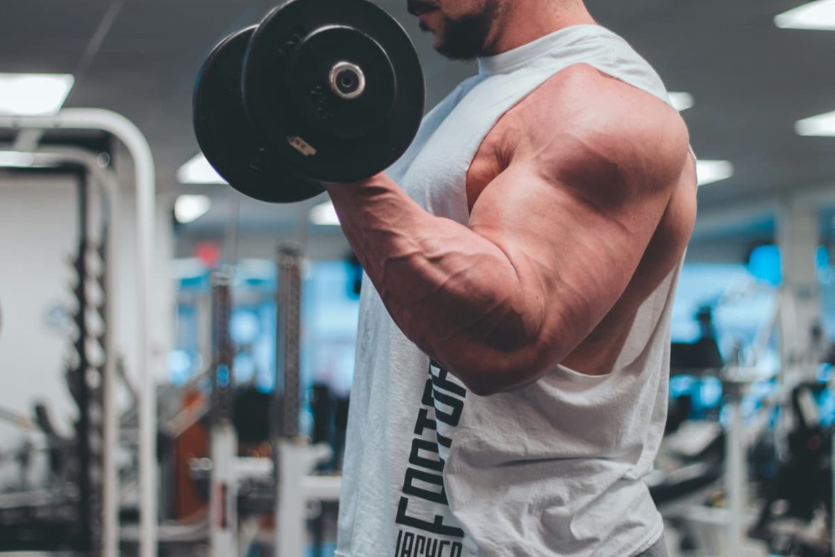 Patient performing a strength workout, showing physical results
